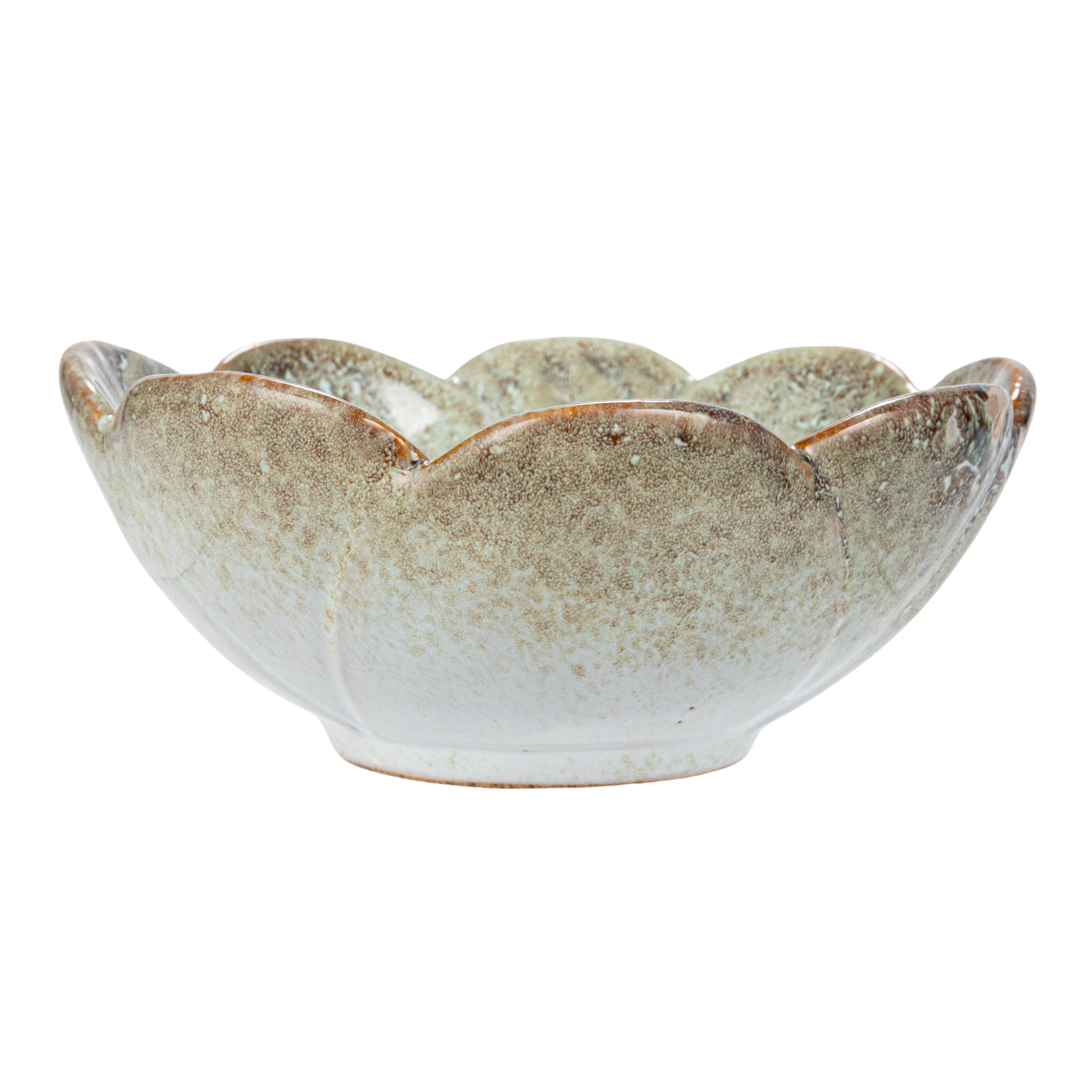 Stoneware bowls with a blue floral pattern and reactive glaze.